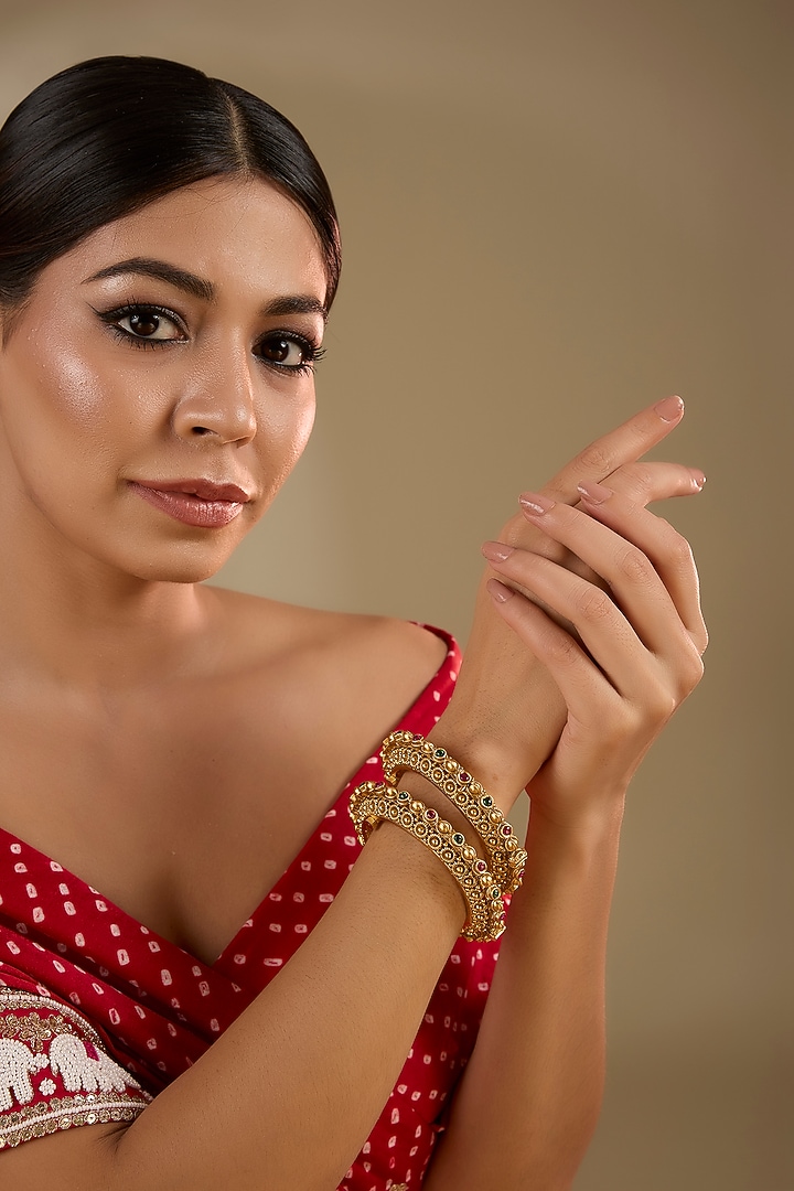 Gold Finish Ruby & Emerald Kemp Stone Kadas (Set Of 2) by Minaki at Pernia's Pop Up Shop