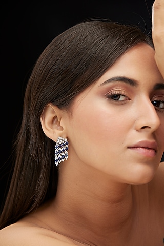 White Finish Cubic Zirconia & Blue Sapphire Dangler Earrings In Sterling Silver by Mirelle