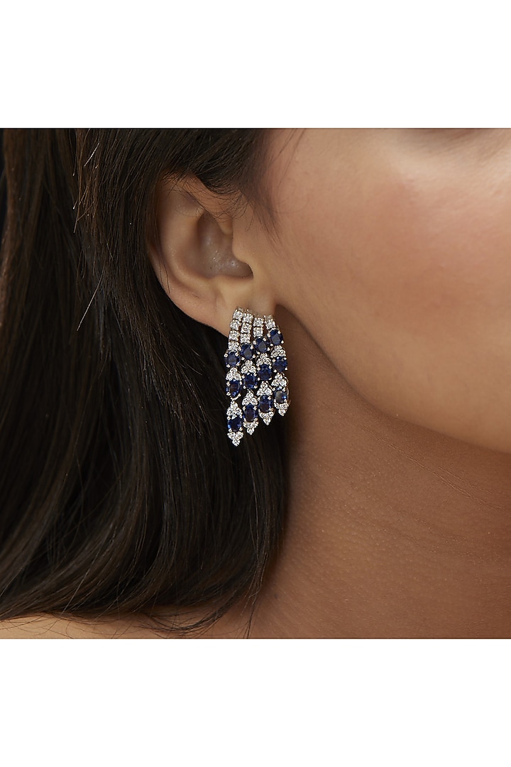 White Finish Cubic Zirconia & Blue Sapphire Dangler Earrings In Sterling Silver by Mirelle at Pernia's Pop Up Shop