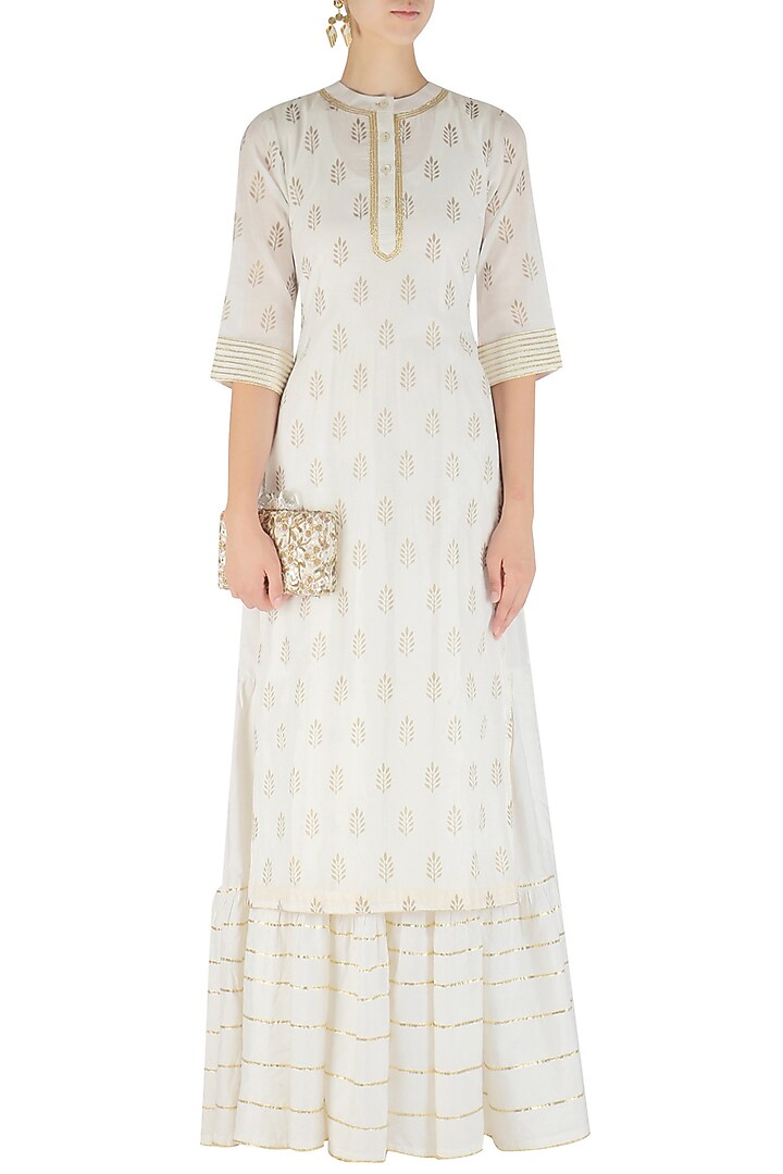 White tiered maxi dress and foil print kurta set available only at Pernia's Pop Up Shop.