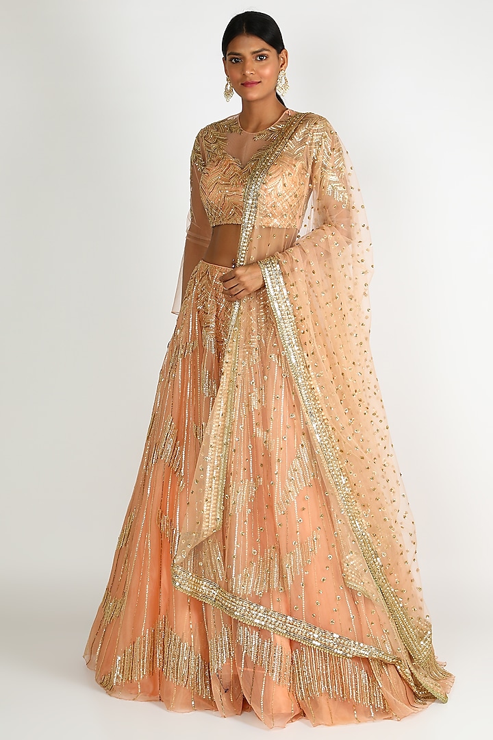 Peach embroidered lehenga set by Megha & Jigar