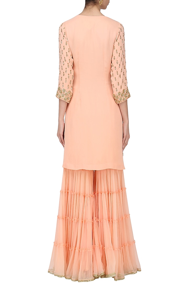 Peach sequins embroidered sharara set available only at Pernia's Pop Up Shop.