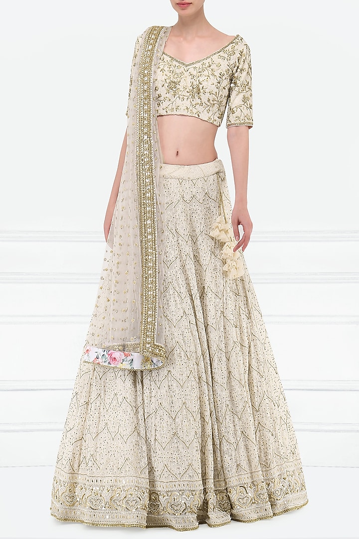 Ivory embroidered lucknavi lehenga set available only at Pernia's Pop Up Shop.
