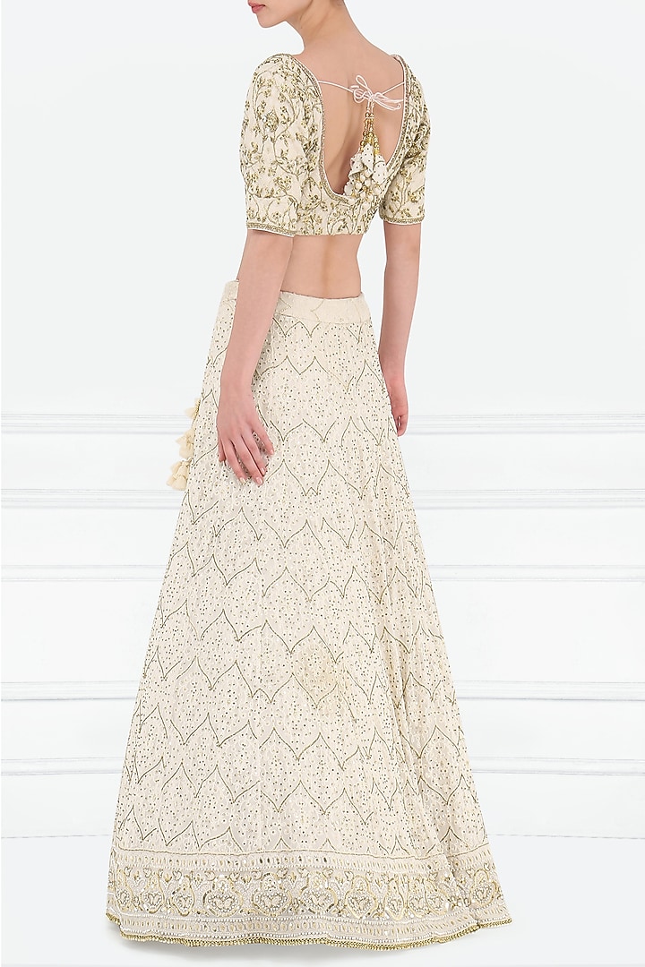 Ivory embroidered lucknavi lehenga set available only at Pernia's Pop Up Shop.
