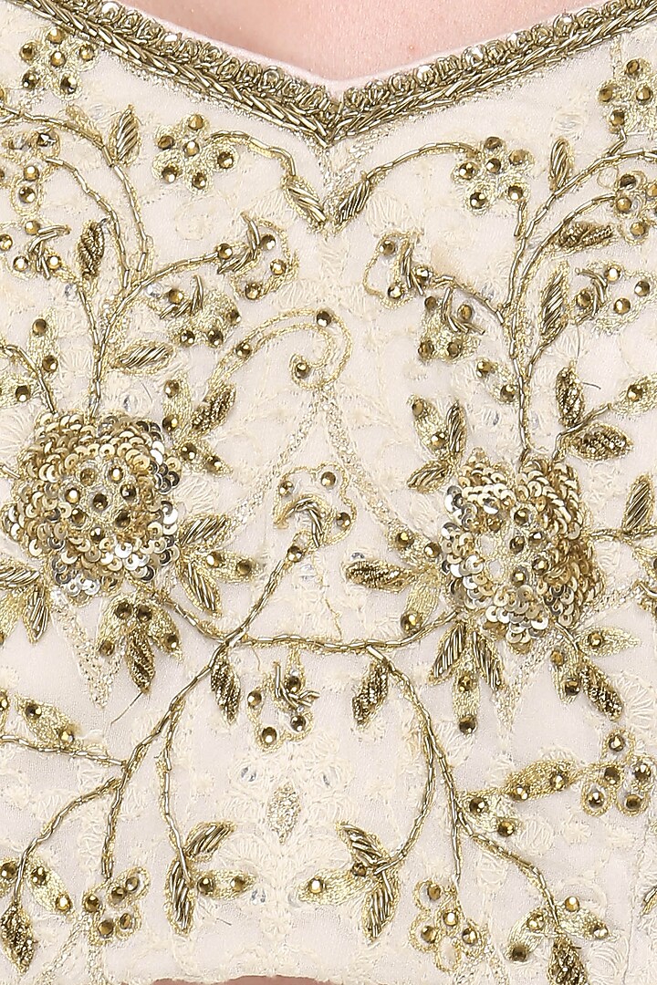 Ivory embroidered lucknavi lehenga set available only at Pernia's Pop Up Shop.