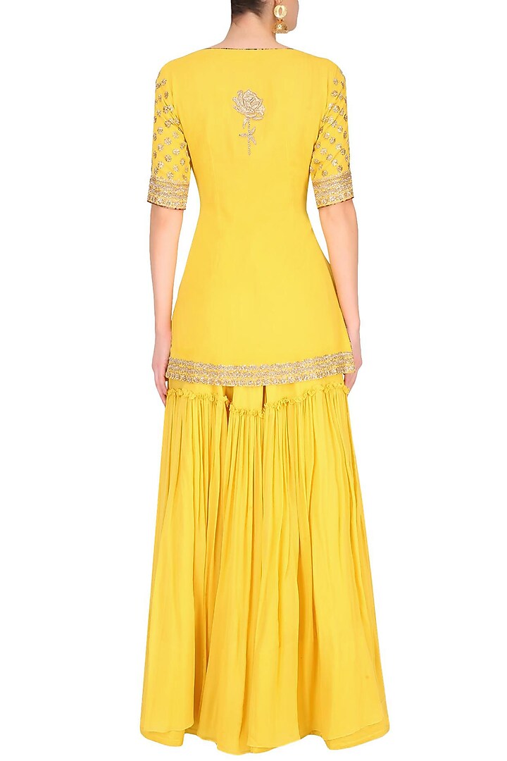 Buttercup color floral motifs short kurta and sharara pants set available only at Pernia's Pop Up Shop.