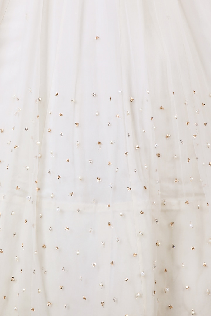 Vanilla color embroidered cape jacket with top and tulle skirt available only at Pernia's Pop Up Shop.
