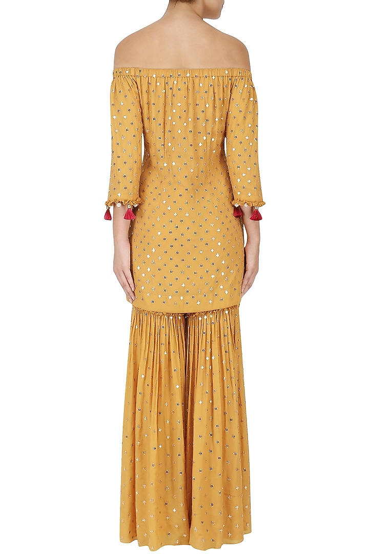 Mustard off-shoulder embroidered kurta and sharara set available only at Pernia's Pop Up Shop.