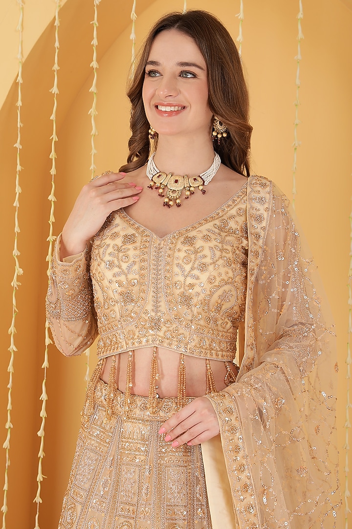 Beige Double Net Sequin Hand Embroidered Wedding Lehenga Set by Milu Madan at Pernia's Pop Up Shop