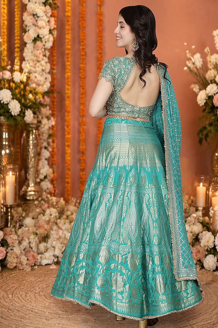 Teal Green Silk Brocade Floral Hand Embroidered Wedding Lehenga Set by Milu Madan at Pernia's Pop Up Shop