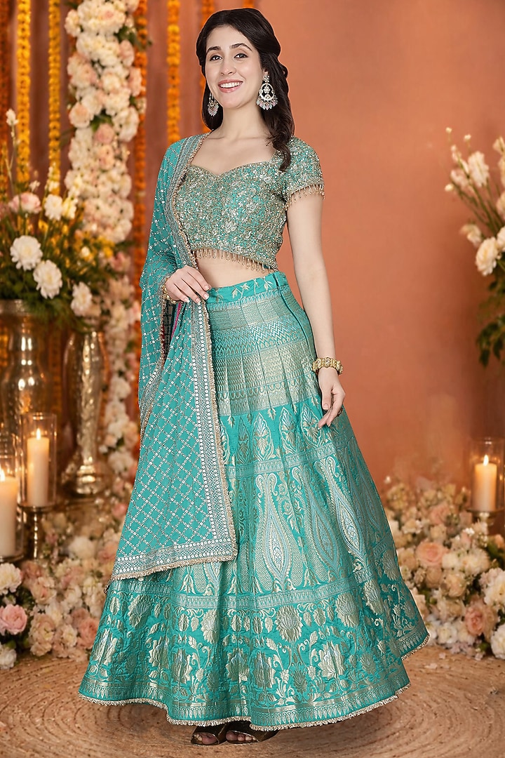 Teal Green Silk Brocade Floral Hand Embroidered Wedding Lehenga Set by Milu Madan at Pernia's Pop Up Shop