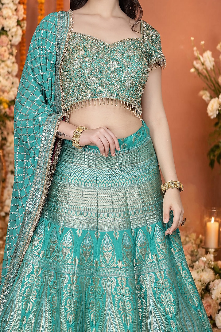 Teal Green Silk Brocade Floral Hand Embroidered Wedding Lehenga Set by Milu Madan at Pernia's Pop Up Shop