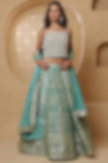 Teal Blue Brocade Pearl Work Wedding Lehenga Set by Milu Madan at Pernia's Pop Up Shop