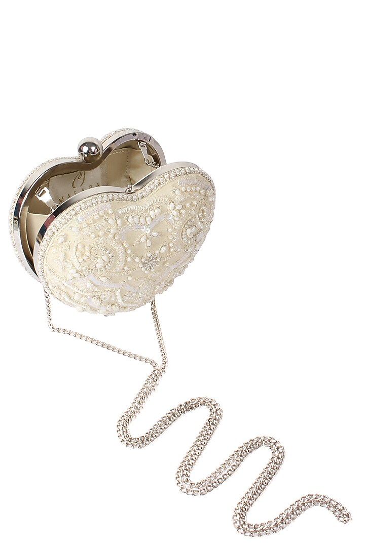 Malasa presents Ivory pearls and beads embroidered heart shaped clutch available only at Pernia's Pop Up Shop.