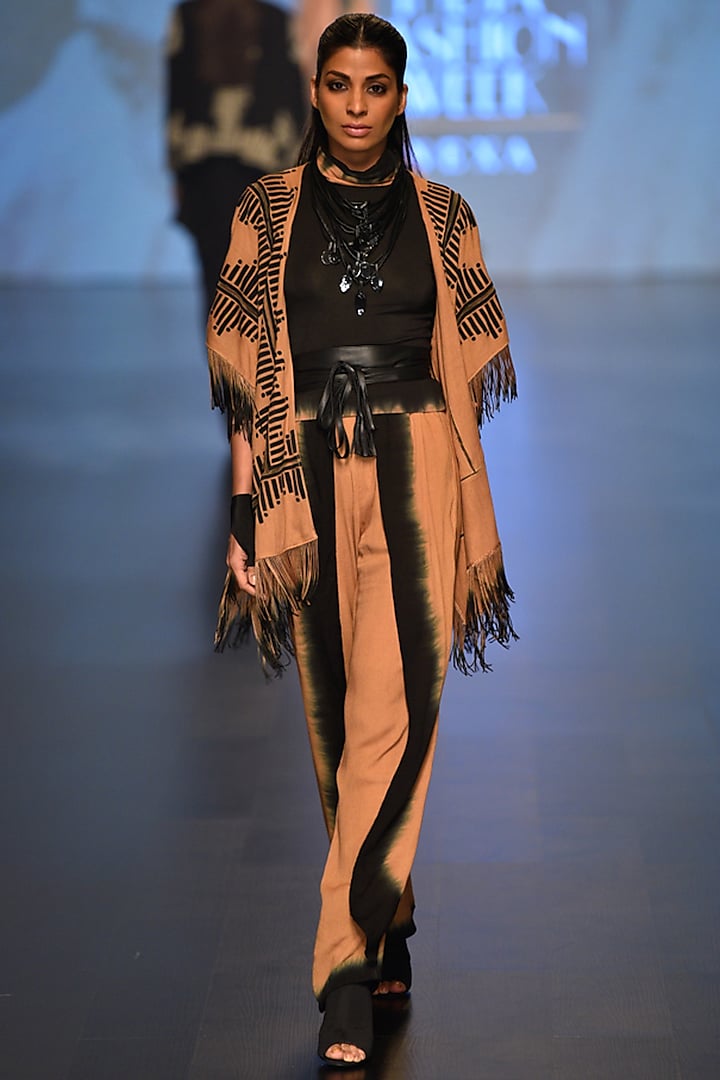 Caramel and black chakra fringe cape with turtle neck tee and Pants available only at Pernia's Pop Up Shop.