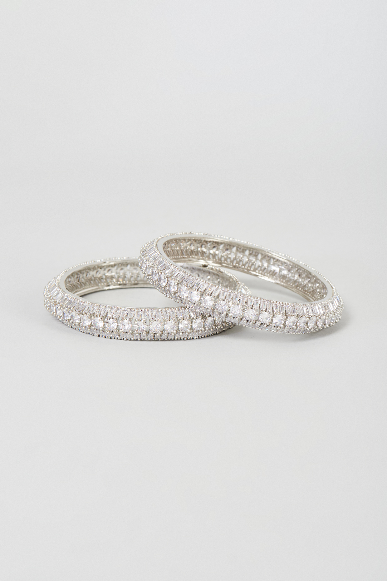 White Finish Zircon Bangles (Set Of 2) by Moh-Maya by Disha Khatri at Pernia's Pop Up Shop