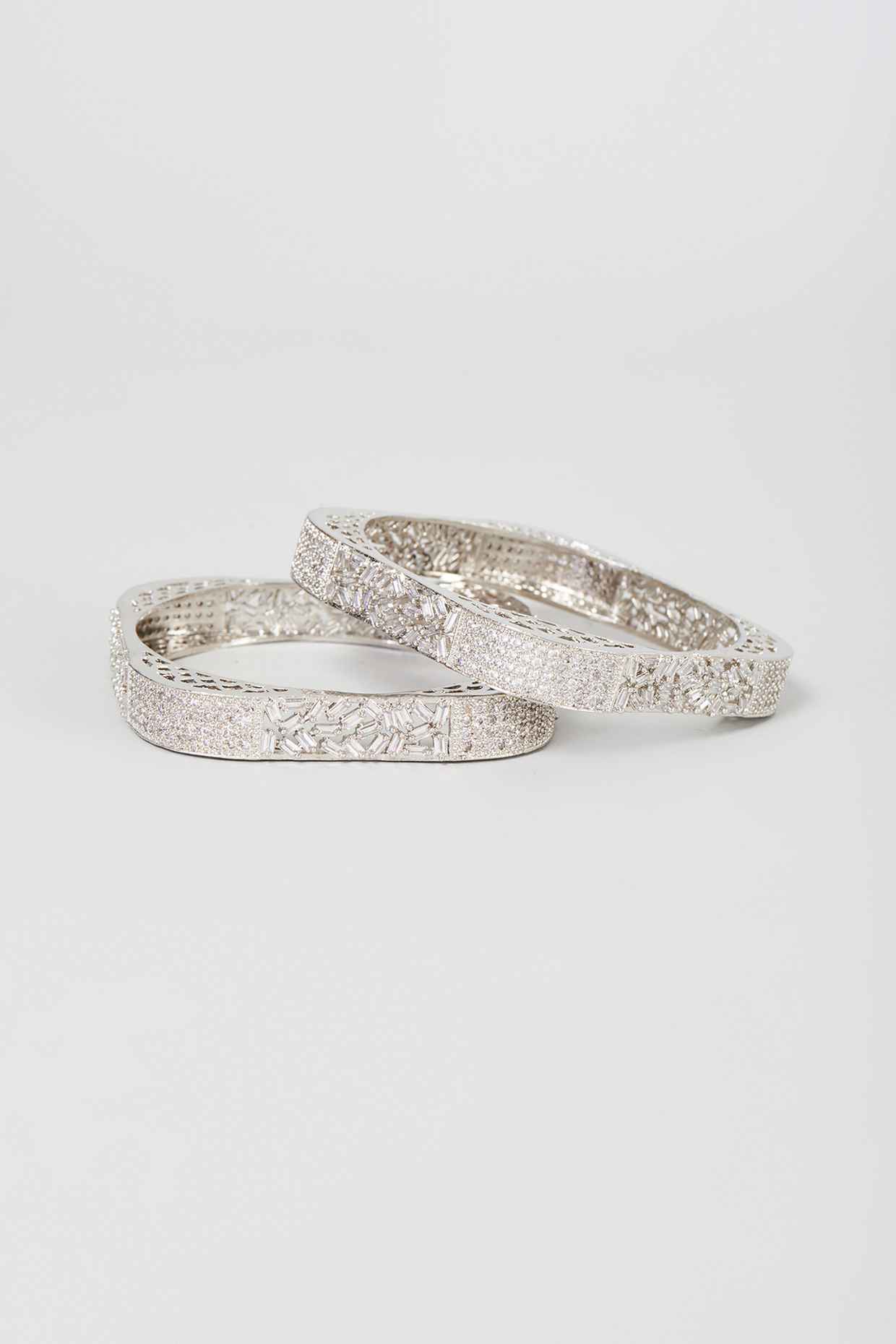 White Finish Zircon Bangles (Set Of 2) by Moh-Maya by Disha Khatri at Pernia's Pop Up Shop
