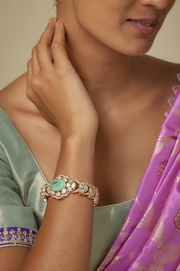 Gold Finish Zircon & Emerald Stone Bracelet by Moh-Maya by Disha Khatri at Pernia's Pop Up Shop