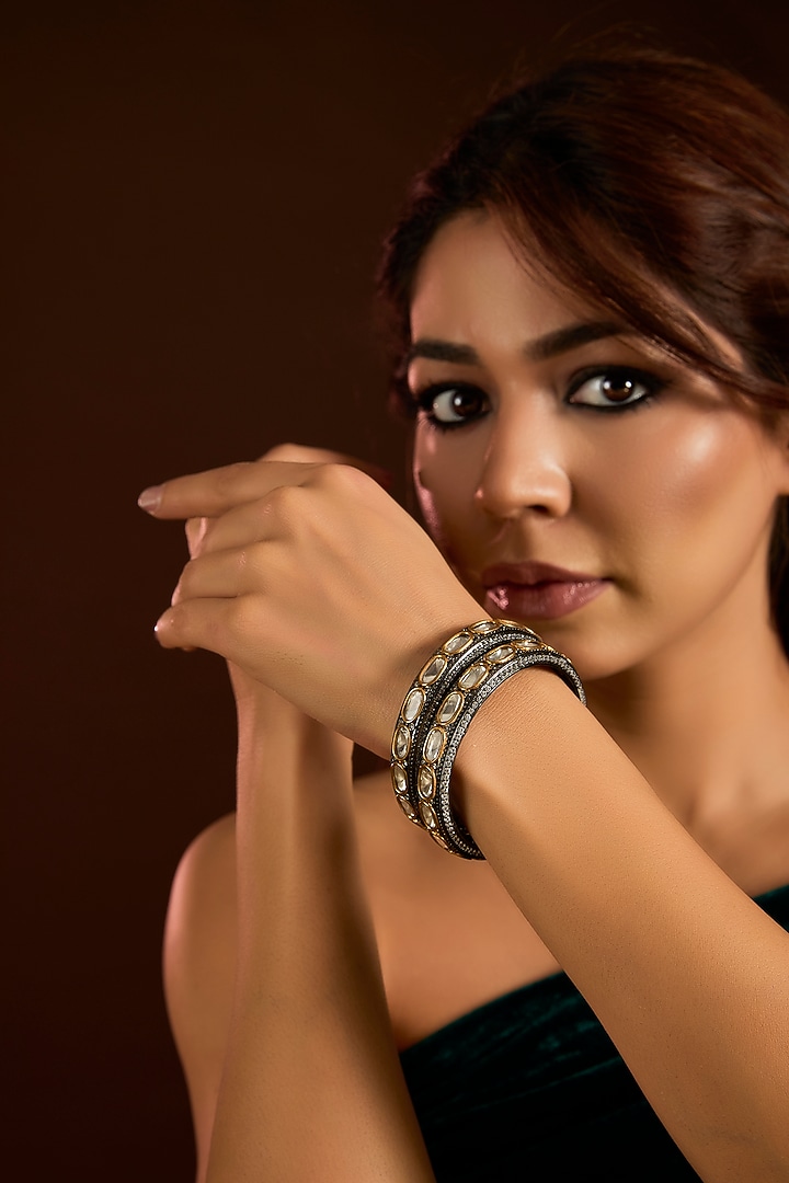 Black Rhodium Finish Kundan Polki & Zircon Bangles (Set Of 2) by Moh-Maya by Disha Khatri at Pernia's Pop Up Shop