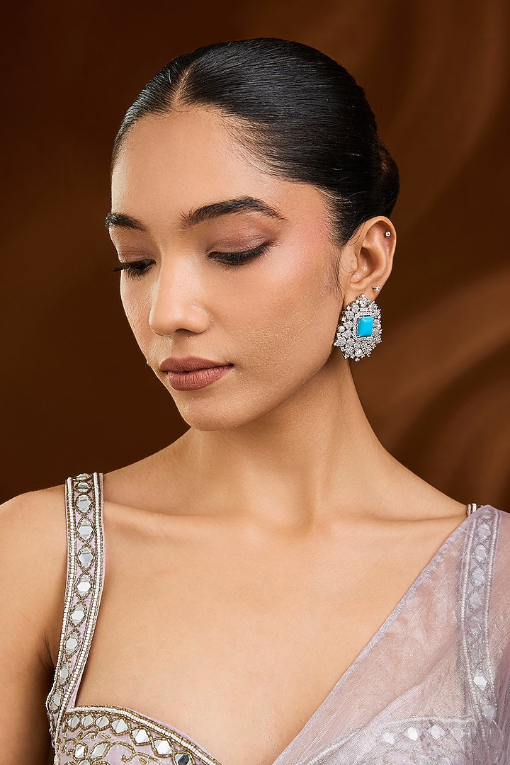 White Finish Blue Stone Stud Earrings by Moh-Maya by Disha Khatri at Pernia's Pop Up Shop