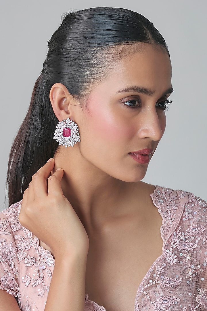 White Gold Finish Zircon & Ruby Stone Stud Earrings by Moh-Maya by Disha Khatri at Pernia's Pop Up Shop