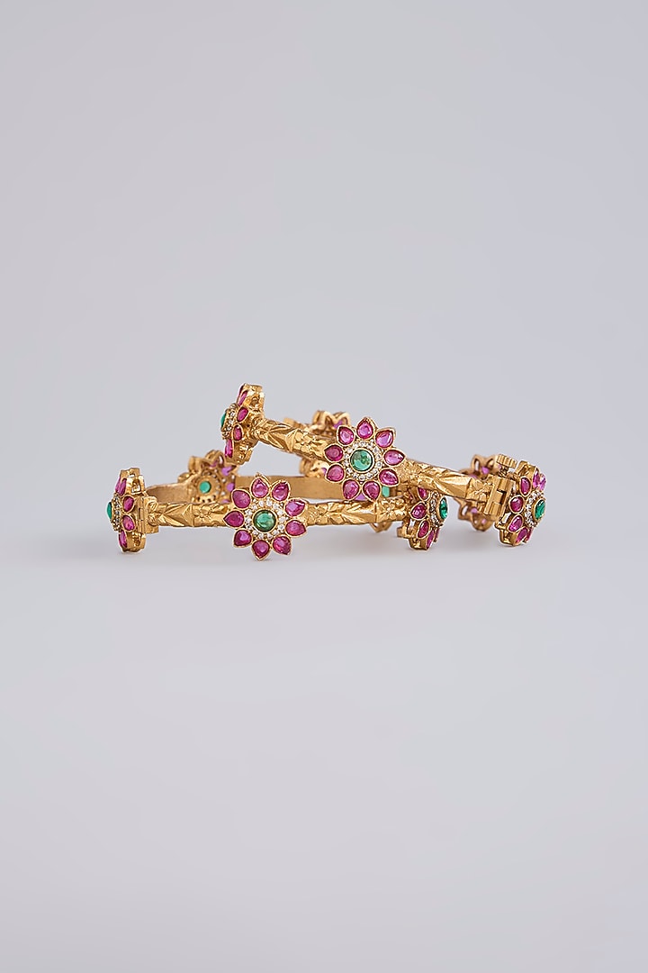 Gold Finish Emerald & Ruby Stone Floral Bangles (Set Of 2) by Moh-Maya by Disha Khatri at Pernia's Pop Up Shop
