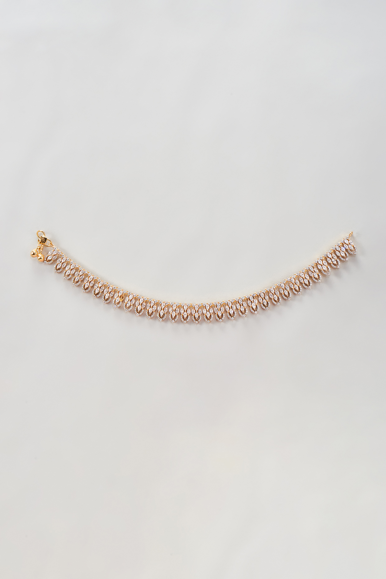 Gold Finish Zircon Anklets (Set Of 2) by Moh-Maya by Disha Khatri at Pernia's Pop Up Shop