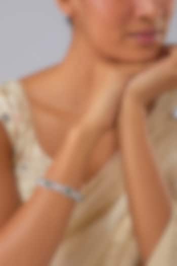 Silver Finish Zircon & Emerald Stone Bracelet by Moh-Maya by Disha Khatri at Pernia's Pop Up Shop