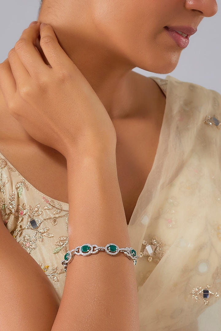 White Finish Zircon & Emerald Stone Bracelet by Moh-Maya by Disha Khatri at Pernia's Pop Up Shop