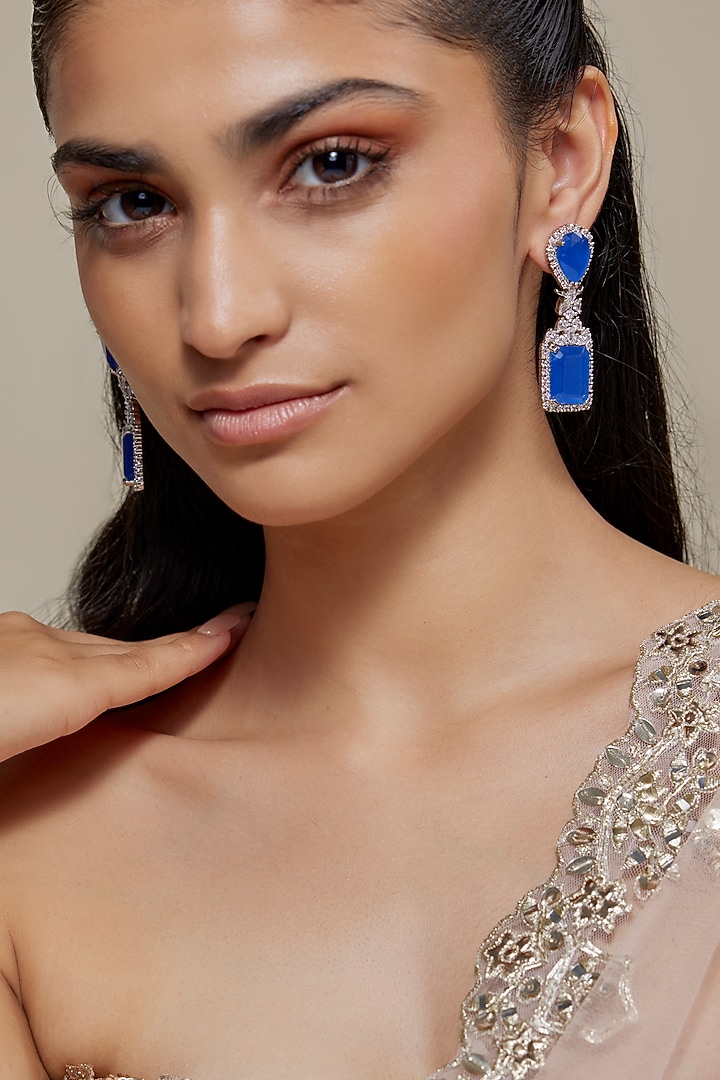 White Finish Zircon & Blue Sapphire Stone Dangler Earrings by Moh-Maya by Disha Khatri at Pernia's Pop Up Shop