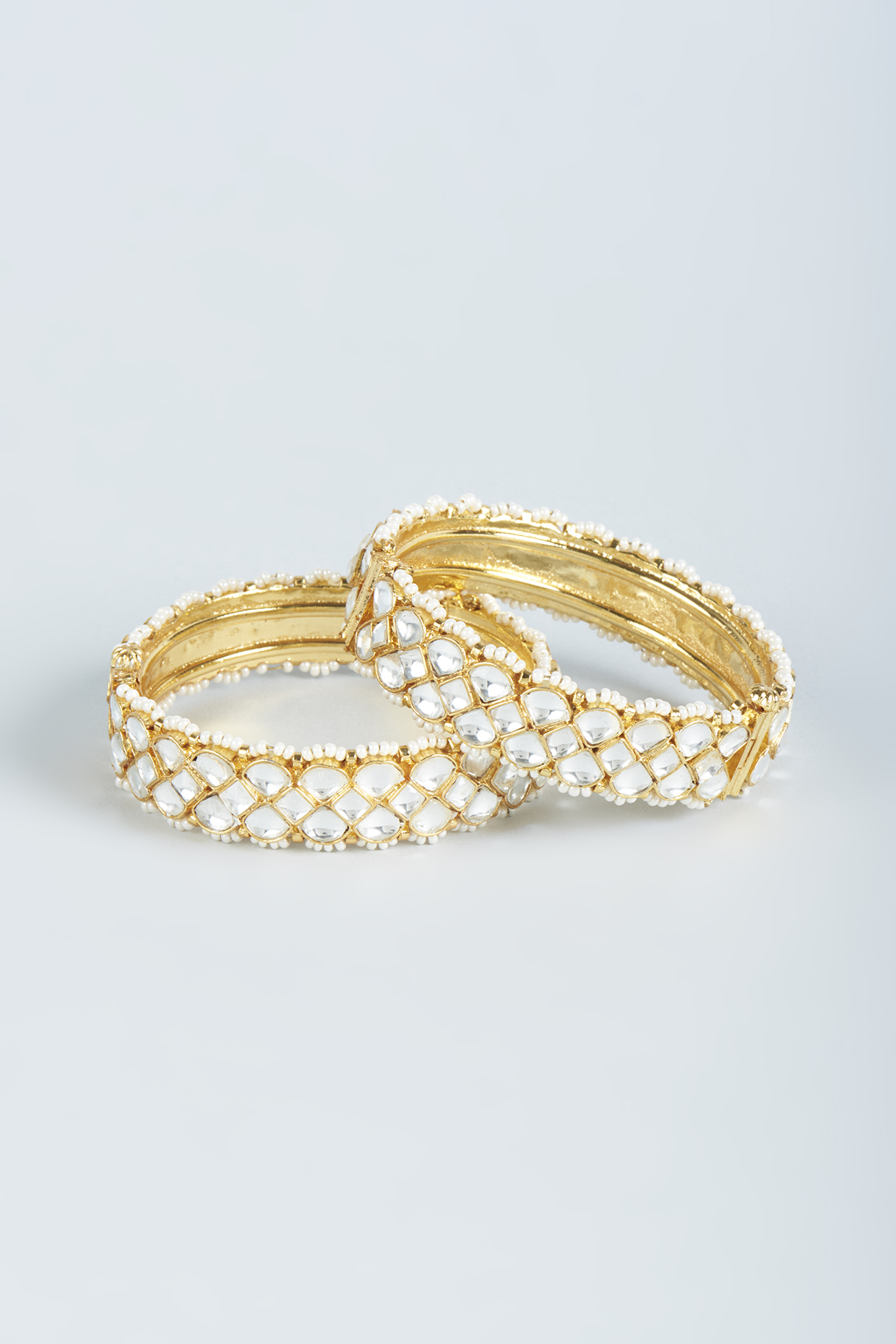 Gold Finish Pearl Kadas (Set of 2) by Moh-Maya by Disha Khatri at Pernia's Pop Up Shop