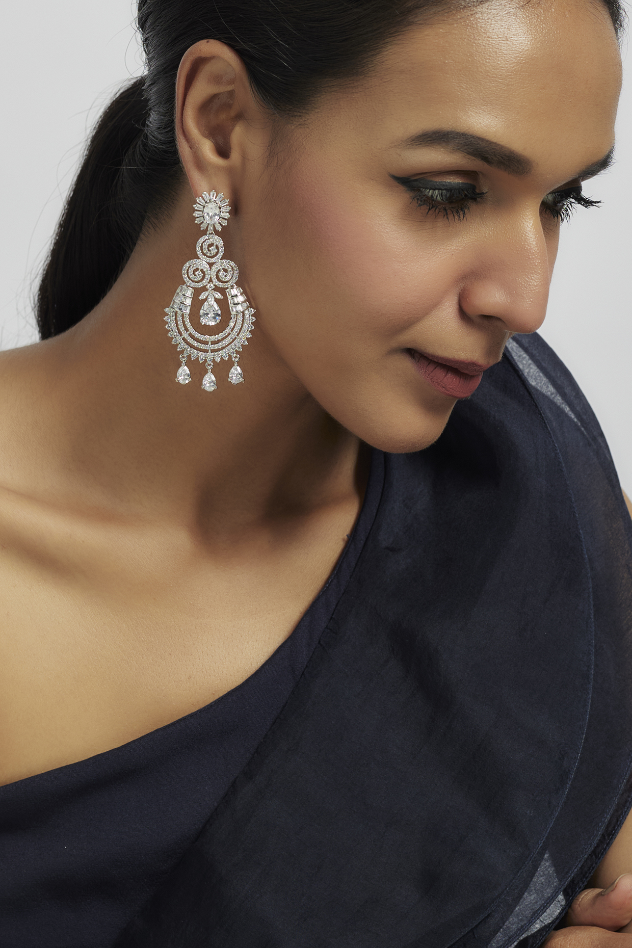 White Finish Zircon Dangler Earrings by Moh-Maya by Disha Khatri at Pernia's Pop Up Shop