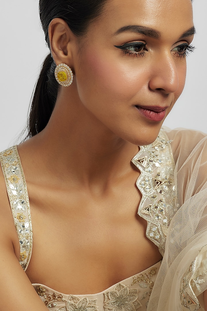 Gold Finish Yellow Zircon Stud Earrings by Moh-Maya by Disha Khatri at Pernia's Pop Up Shop