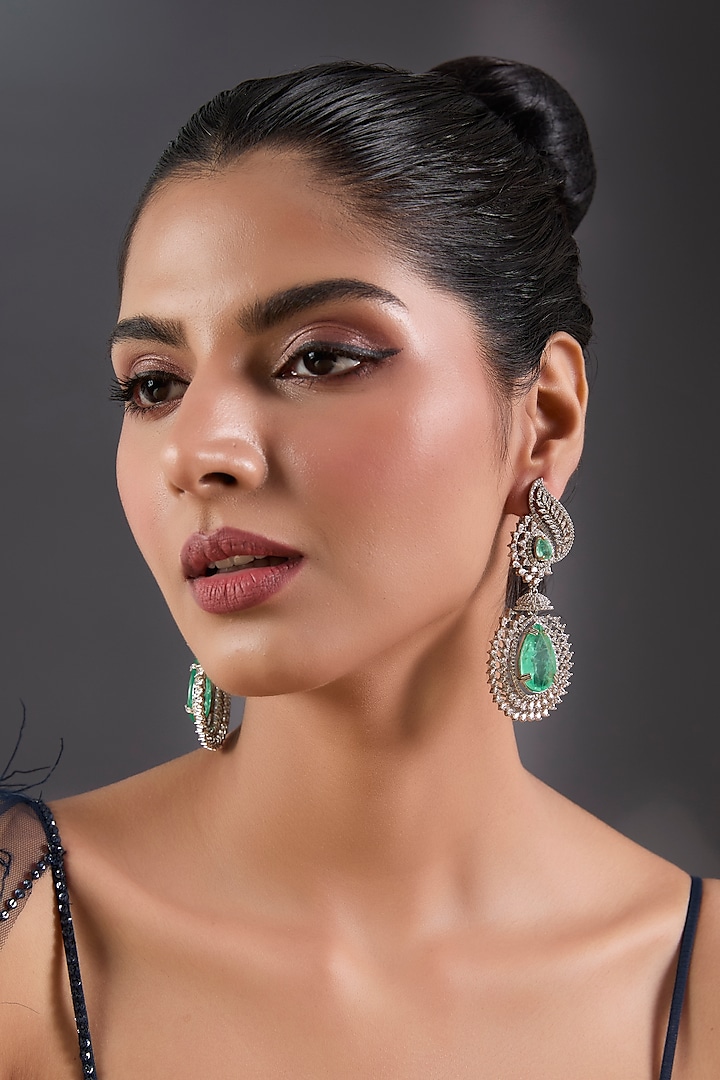 White Finish Zircon & Emerald Stone Dangler Earrings by Moh-Maya by Disha Khatri at Pernia's Pop Up Shop
