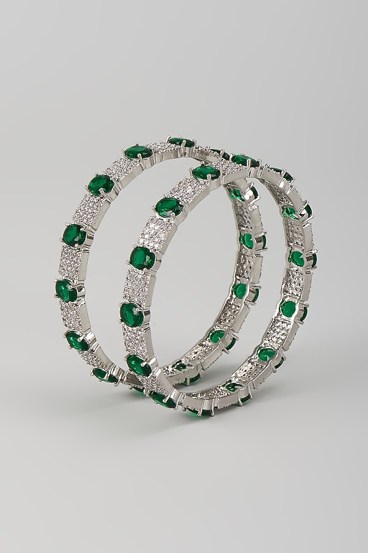 Silver Finish Zircon & Emerald Bangles (Set Of 2) by Moh-Maya by Disha Khatri at Pernia's Pop Up Shop