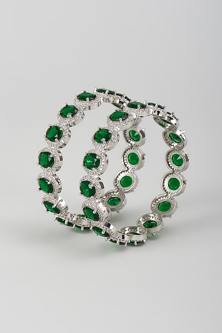 Silver Finish Zircon & Emerald Stone Bangles (Set Of 2) by Moh-Maya by Disha Khatri at Pernia's Pop Up Shop