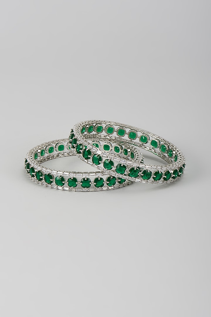 Silver Finish Zircon & Emerald Stone Bangles (Set Of 2) by Moh-Maya by Disha Khatri at Pernia's Pop Up Shop