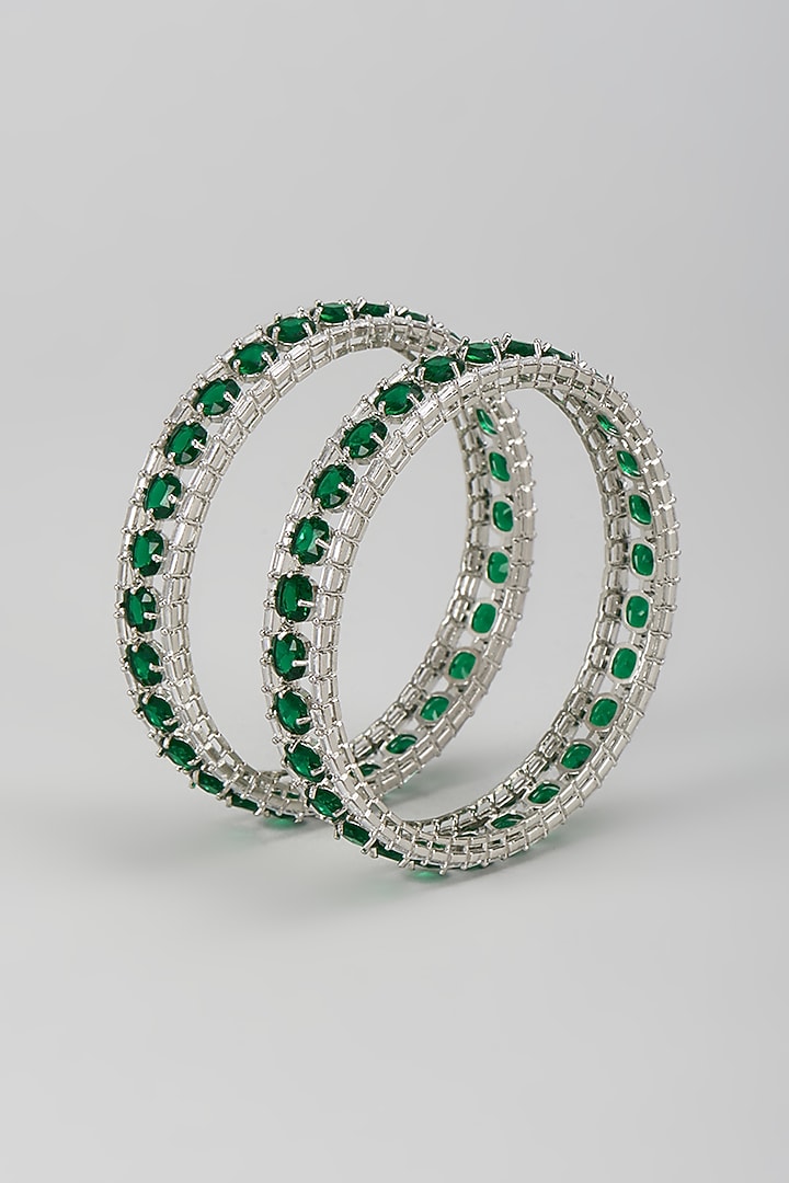 Silver Finish Zircon & Emerald Stone Bangles (Set Of 2) by Moh-Maya by Disha Khatri at Pernia's Pop Up Shop
