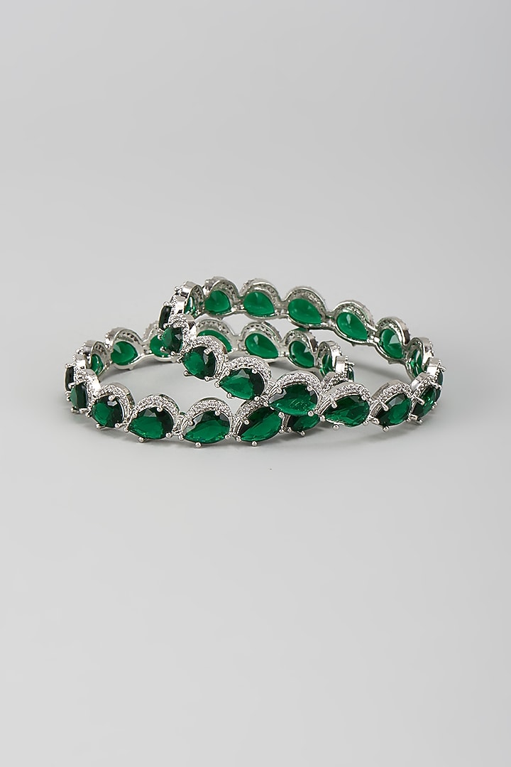 Silver Finish Zircon & Emerald Stone Bangles (Set Of 2) by Moh-Maya by Disha Khatri at Pernia's Pop Up Shop