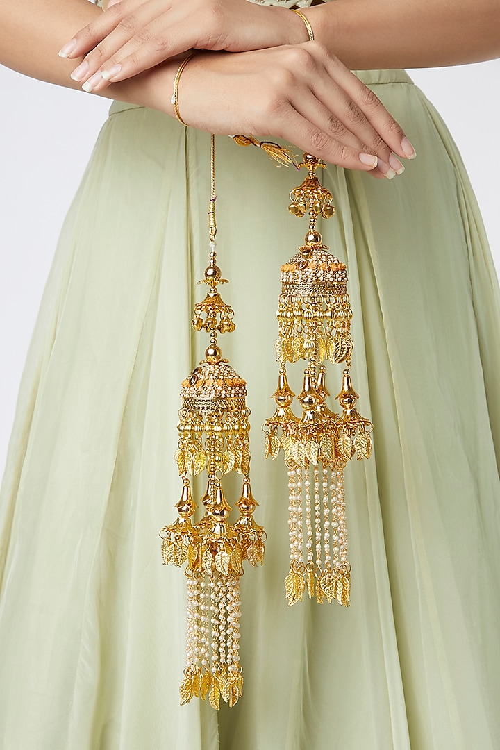 Gold Finish Hanging Kaleeras With Orange Stones by Moh-Maya by Disha Khatri