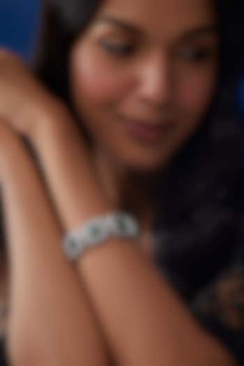 White Finish Zircon & Emerald Stone Bracelet by Moh-Maya by Disha Khatri at Pernia's Pop Up Shop