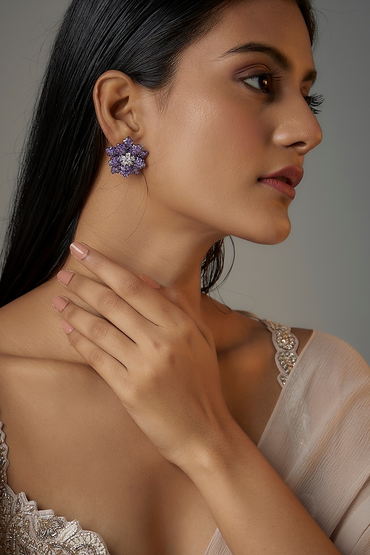 White Finish Dark Purple Zircon Floral Stud Earrings by Moh-Maya by Disha Khatri at Pernia's Pop Up Shop