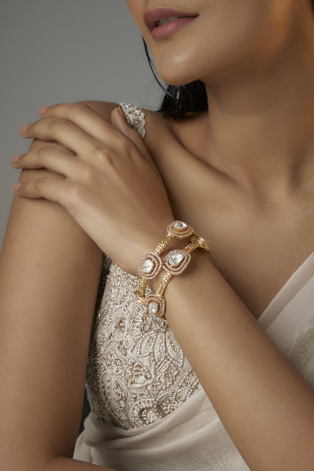 Gold Finish Kundan Polki Oval Kadas (Set Of 2) by Moh-Maya by Disha Khatri at Pernia's Pop Up Shop