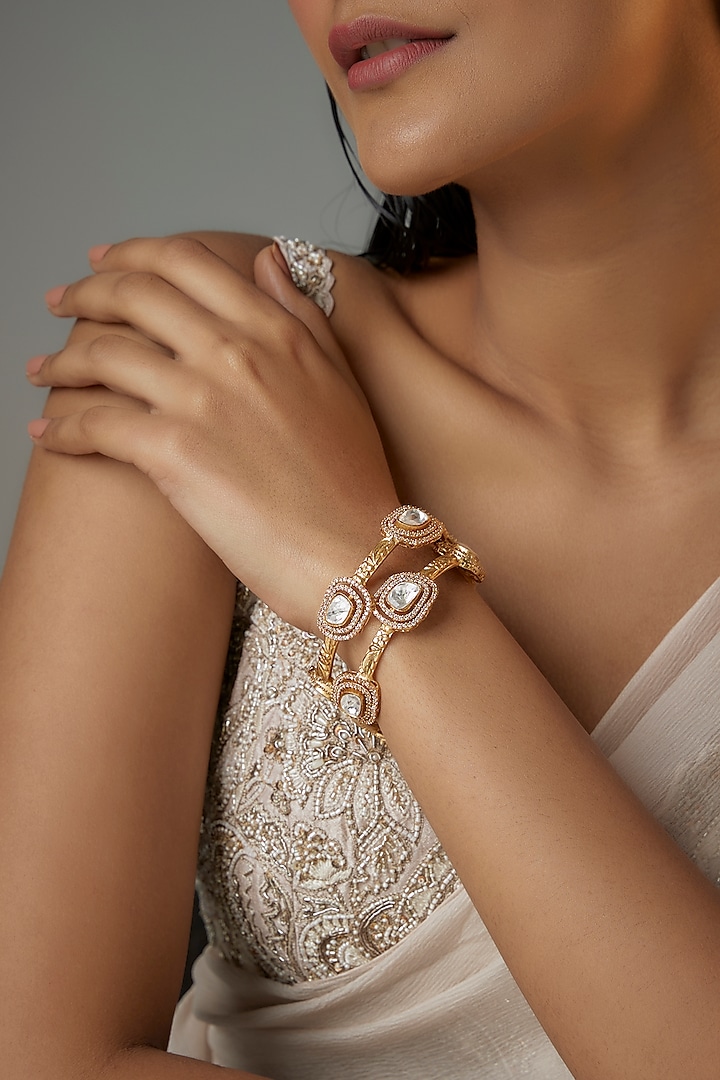 Gold Finish Kundan Polki Oval Kadas (Set Of 2) by Moh-Maya by Disha Khatri at Pernia's Pop Up Shop