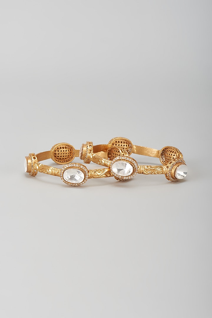 Gold Finish Kundan Polki Oval Kadas (Set Of 2) by Moh-Maya by Disha Khatri at Pernia's Pop Up Shop