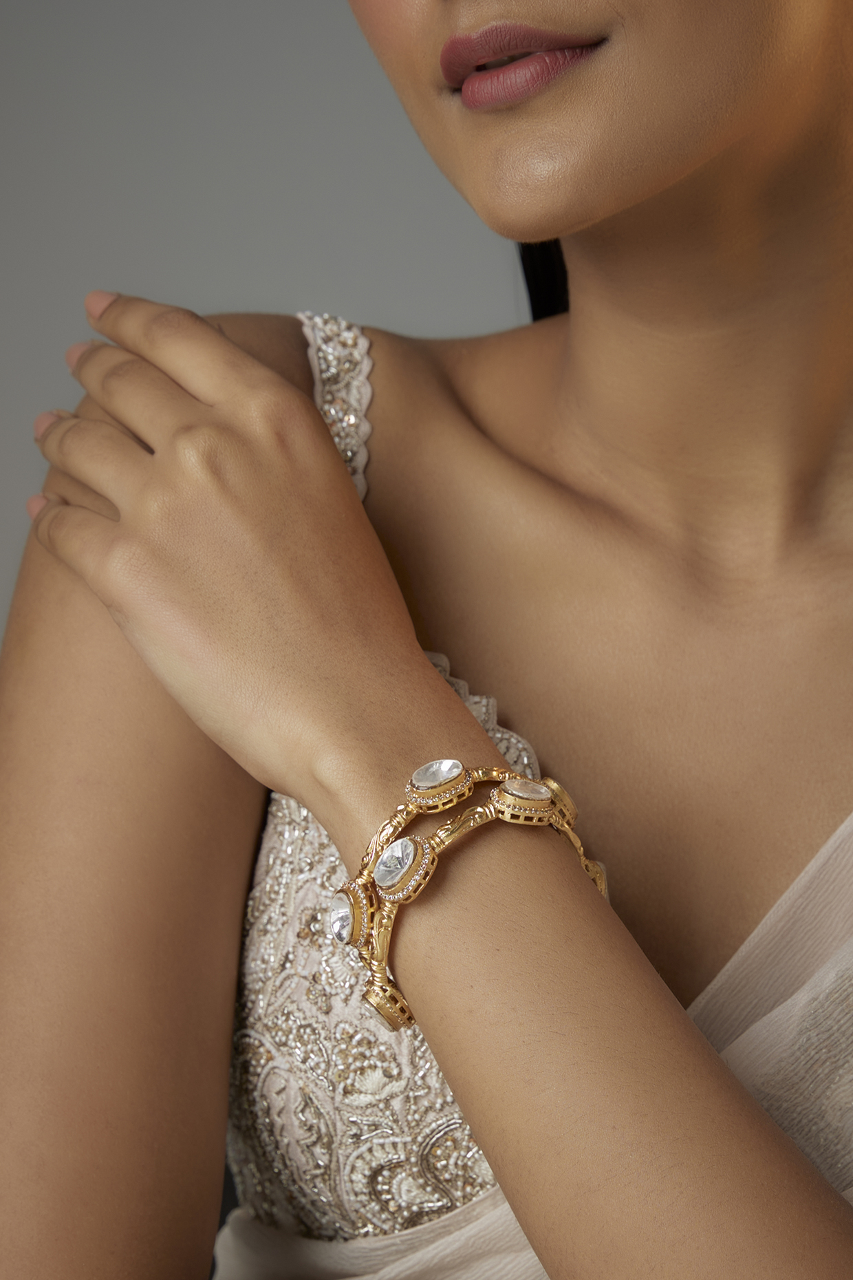 Gold Finish Kundan Polki Oval Kadas (Set Of 2) by Moh-Maya by Disha Khatri at Pernia's Pop Up Shop