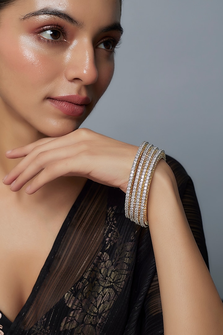 Gold Finish Zircon Bangles (Set Of 4) by Moh-Maya by Disha Khatri at Pernia's Pop Up Shop