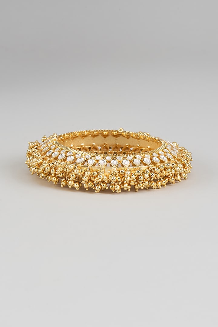 Gold Finish Kundan Polki & Beaded Bracelet by Moh-Maya by Disha Khatri at Pernia's Pop Up Shop