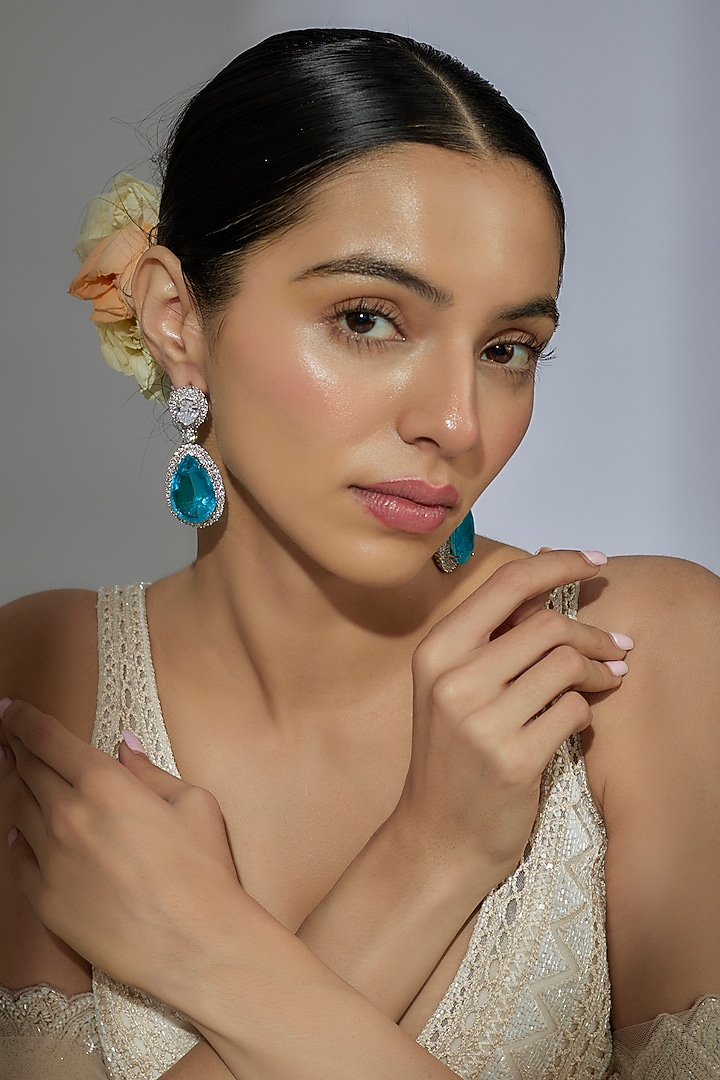 White Finish Aqua Zircon Dangler Earrings by Moh-Maya by Disha Khatri at Pernia's Pop Up Shop