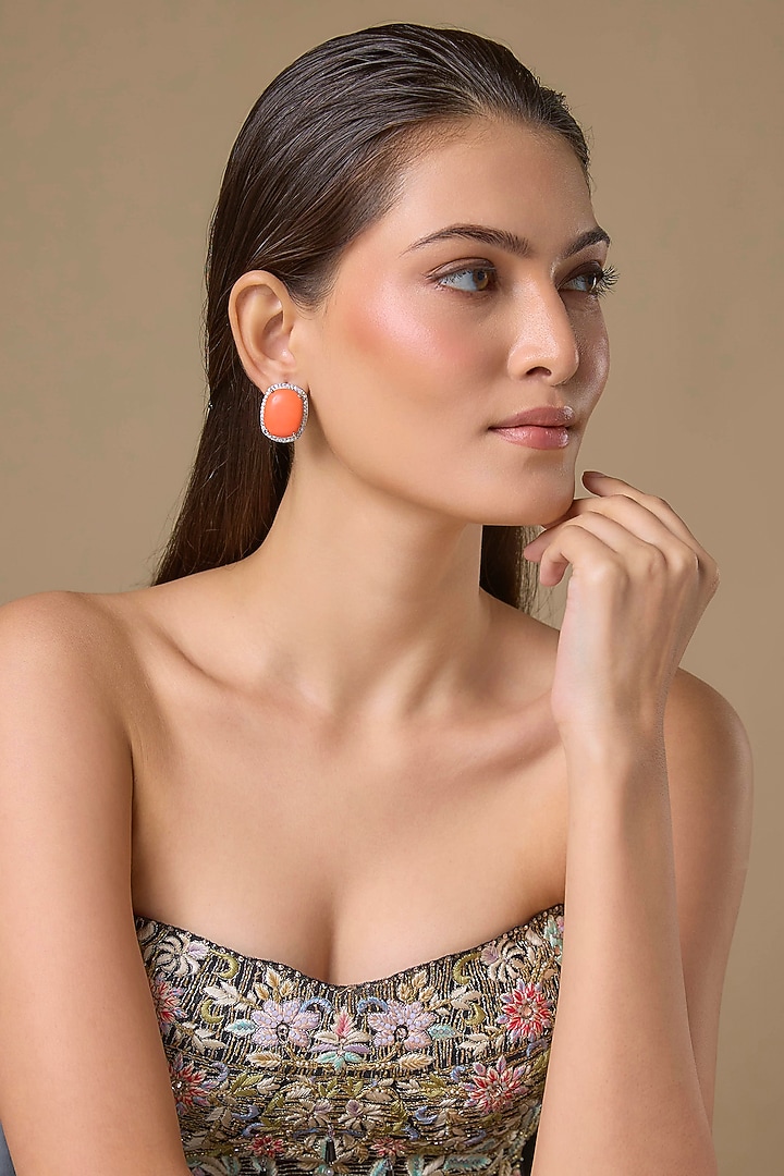 Silver Finish Zicon & Orange Stone Stud Earrings by Moh-Maya by Disha Khatri at Pernia's Pop Up Shop